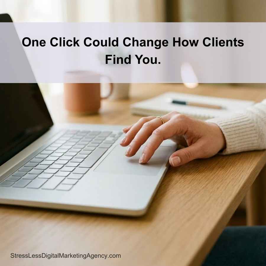 A person’s hand rests on a laptop keyboard on a wooden desk with a notepad and a mug nearby. Text reads: One Click Could Change How Clients Find You. Website: StressLessDigitalMarketingAgency.com. | stresslessdigitalmarketingagency.com